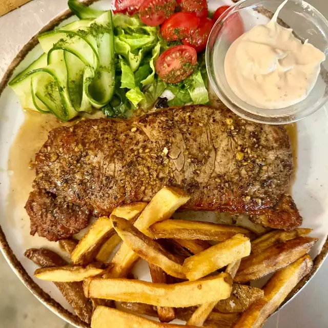 Steak with fries and salad
